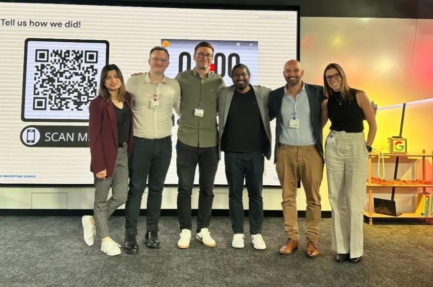 Six digital marketing professionals standing together on stage at an industry event.